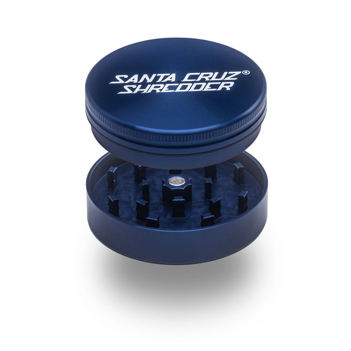 Blue Santa Cruz Shredder 2-Piece Large Grinder – magnetic top and sharp cutting teeth shown apart.