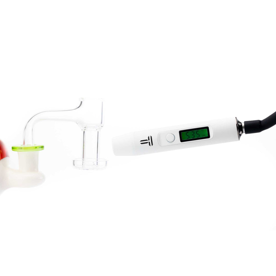Terpometer Infrared LE White in use, measuring temperature of a quartz banger with green digital display for optimal dabbing accuracy.