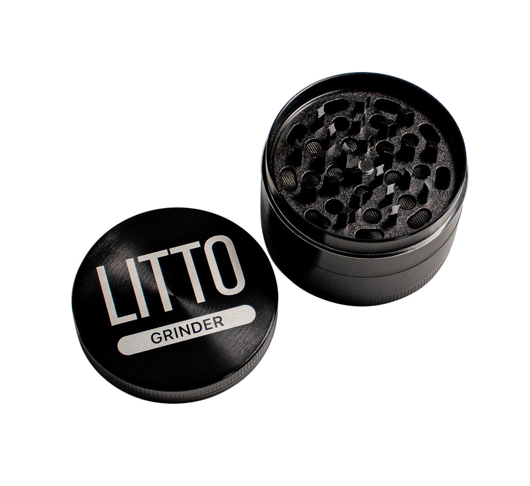 Litto - 4 Piece Grinder with heavy zinc alloy construction and 63mm diameter, shown open to reveal sharp grinding teeth and sleek black finish.