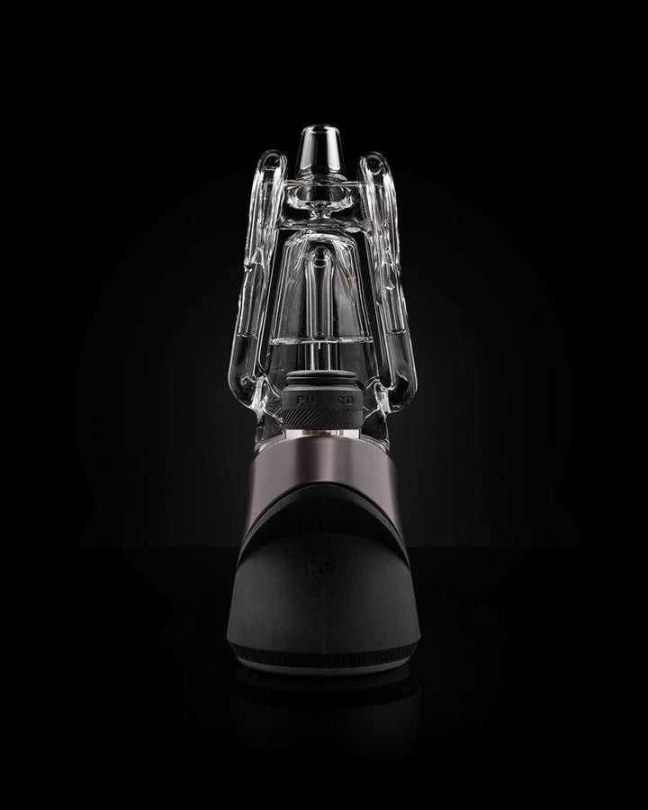 Puffco Ryan Fitt Recycler Glass 2.0 – standing upright on black backdrop, detailed airflow chamber visible.