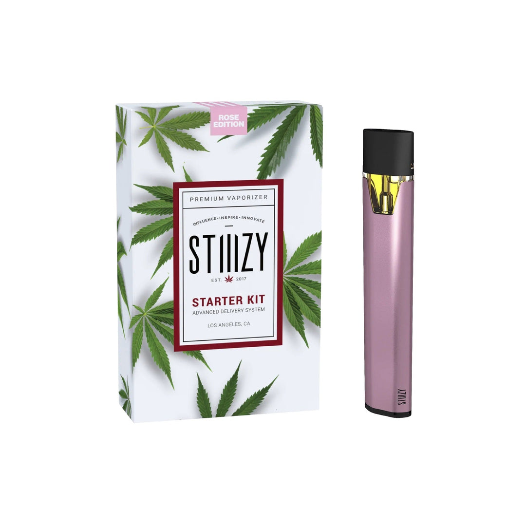 Stiiizy Starter Kit Rose Edition vaporizer with pink finish, USB charging cable and 210mAh battery, pod not included.